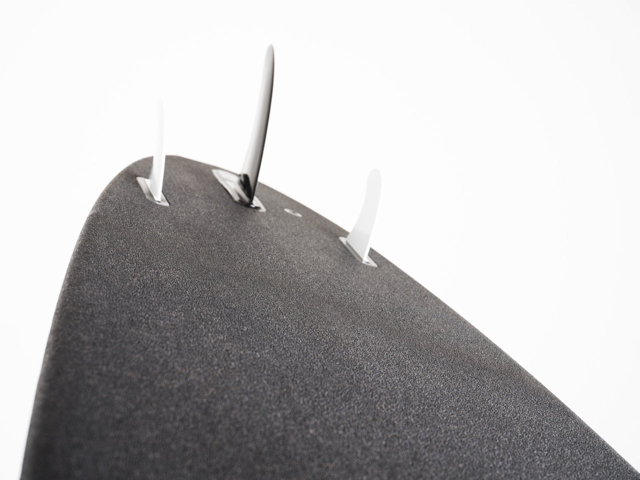 The backside of the tail of a 8 foot Positive Vibe Warriors Scout surfboard with two futures fins and an F6 futures fin