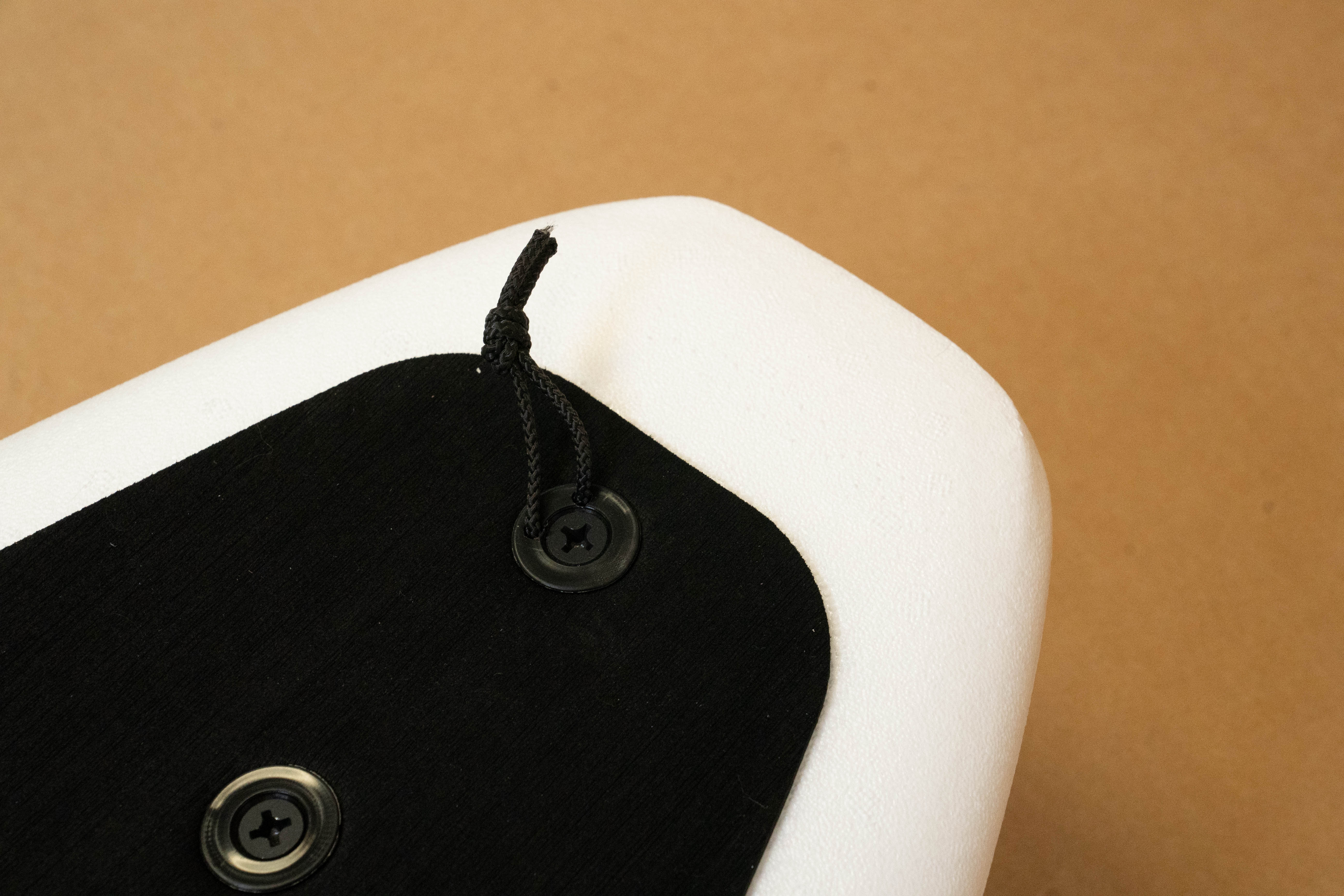 Leash on tail of a white 6 foot 4 Formula Fun Foamies zipper surfboard