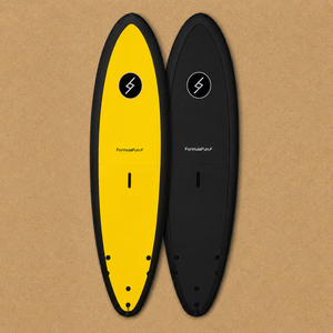 Yellow and black Formula Fun 6'0" Jam foam surfboards on a tan textured surface