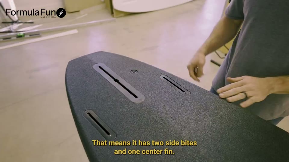 The DOHO underside, showing its center fin box and two side fin boxes